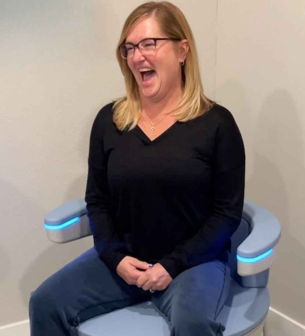 bladder control women laughing sitting on emsella kegel throne westrick clinic